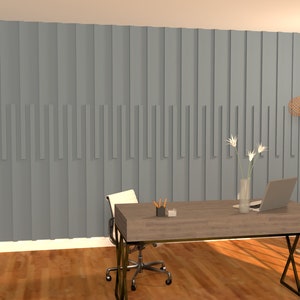 May include: A home office with a gray wall featuring a vertical wood panel design. A wooden desk with a laptop, vase of white flowers, and a lamp sits in front of the wall. A white office chair is pulled up to the desk.