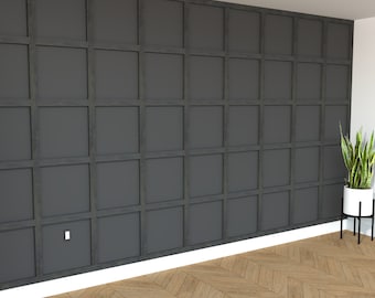 May include: A dark gray wall with a grid pattern of raised wood panels. The wall has a white baseboard and a white electrical outlet. The floor is a light brown wood with a herringbone pattern.