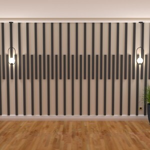 May include: A room with a wood floor and a wall with a geometric pattern of black and white vertical lines. Two black pendant lights with clear glass globes hang from the ceiling. A potted plant with green leaves is on the right side of the image.