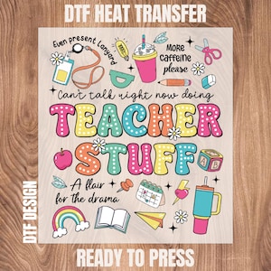 May include: A colorful DTF heat transfer design with the words "TEACHER STUFF" and various school-themed illustrations. Includes a lanyard, coffee cup, apple, scissors, and the text "Can't talk right now doing".