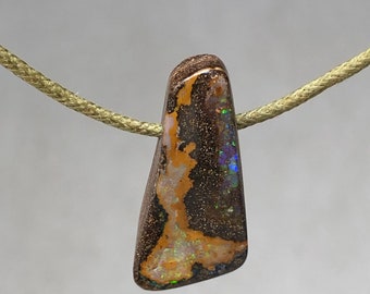 30.3 ct boulder opal pendant. Australian opal cut in our workshop in France. Supplied with cotton cord.