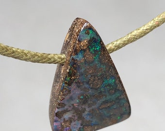 19.8 ct boulder opal pendant. Australian opal cut in our workshop in France. Pendant supplied with a cotton cord.