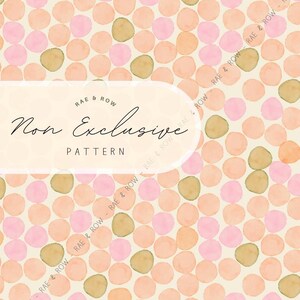 May include: A watercolor pattern featuring a repeating design of pink, peach, and olive-green circles on a cream background. The text "RAE & ROW Non Exclusive PATTERN" is displayed in a white oval.