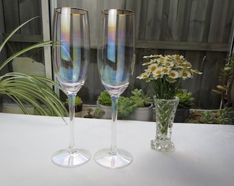 Pair of tall vintage iridescent Champagne Flutes with gold rim