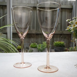 Pair of hand blown pink glass wine glasses