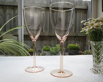 Pair of hand blown pink glass wine glasses