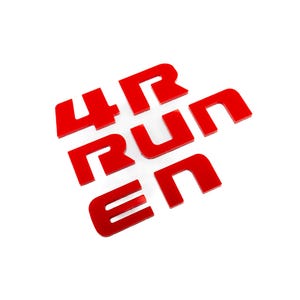 May include: Red 4Runner emblem letters. The letters are separate and appear to be made of a glossy material. The letters are arranged to spell out "4 RUN EN" on a white background.
