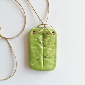 Handmade Ceramic Pendant Necklace: Pressed Wild Plant Design