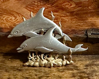 Playful JJ Jonette Vintage pewter and gold tone Brooch. A beautiful dolphins swimming in a beautiful gold seaweed , coral and even starfish!