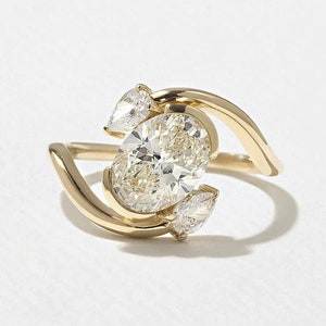 Oval Lab Grown Diamond Engagement Ring: Pear Side Stones, Hammered Gold Band