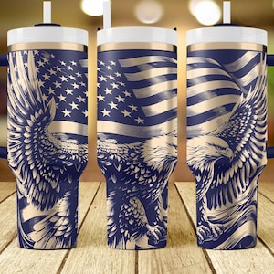 May include: A stainless steel tumbler with a navy blue and gold design featuring an American flag and an eagle. The tumbler has a lid and a straw.