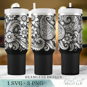 Peut inclure: Un gobelet noir et blanc avec un motif paisley et floral. Le motif est sans couture et s'enroule autour de tout le gobelet. Le gobelet est présenté avec une paille.