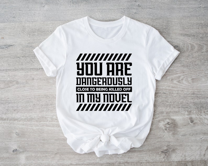 a t - shirt that says you are dangerous in my novel