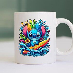May include: A white ceramic mug with a colorful illustration of Stitch from Lilo & Stitch riding a surfboard in a wave. The design features bright colors, including blue, green, yellow, orange, and pink.