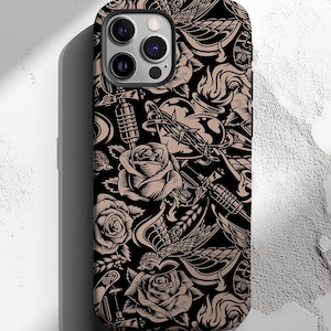 May include: Black iPhone case with a repeating tattoo-style design. The pattern features roses, hearts, daggers, and other classic tattoo motifs in tan and black. The case has a glossy finish and a camera bump.