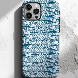 May include: A white phone case with a blue fish pattern. The case has a camera cutout on the back.
