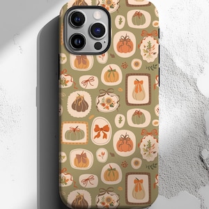 May include: A phone case with a fall-themed pattern. The case features a repeating design of pumpkins, bows, and floral elements in shades of orange, brown, and green on a light green background. The case is designed to fit a smartphone.