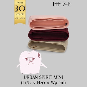 May include: Three felt Urban Spirit Mini organizers in pink, burgundy, and beige, stacked on top of each other. The beige organizer has a gold zipper. The image includes text that says "WITH 30 COLOR OPTIONS" and "URBAN SPIRIT MINI (L16.7 x H20 x W9 cm)".