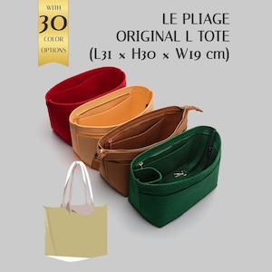 May include: Four felt bag organizers in red, light orange, brown, and dark green, designed for a Le Pliage Original L tote measuring 31 x 30 x 19 cm. Each organizer features multiple interior pockets and a central compartment for structured storage.