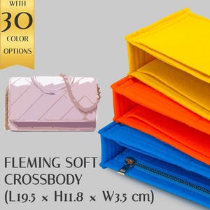 May include: A stack of three felt handbag organizers in yellow, orange, and blue, featuring a zipper closure on the blue unit. A light pink quilted crossbody bag is shown alongside text stating Fleming Soft Crossbody L19.5 x H11.8 x W3.5 cm.