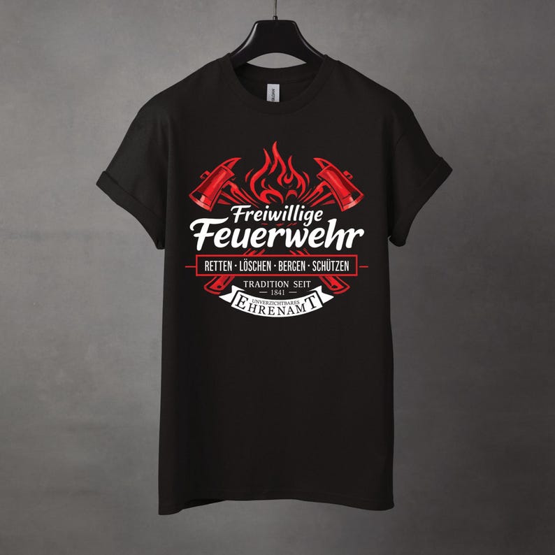 May include: Black t-shirt featuring a red and white graphic. The design includes crossed axes, flames, and the German text "Freiwillige Feuerwehr" (Volunteer Fire Department). Additional text includes "RETTEN - L&Ouml;SCHEN - BERGEN - SCH&Uuml;TZEN" and "TRADITION SEIT 1841".
