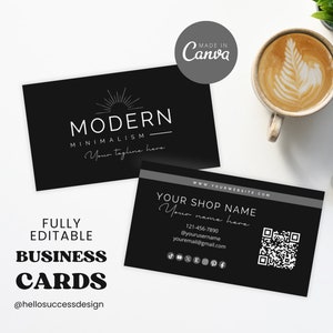 May include: Two black and white business cards with a modern minimalist design. The top card features a sunburst graphic and the text "MODERN MINIMALISM - Your tagline here". The bottom card features the text "YOUR SHOP NAME - Your name here", a phone number, email address, social media icons, and a QR code.