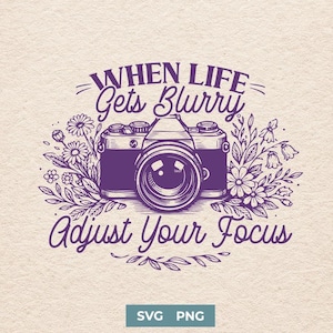 May include: Purple graphic design featuring a vintage camera illustration surrounded by floral elements. The text reads "When Life Gets Blurry, Adjust Your Focus." The design includes the text "SVG PNG" at the bottom.