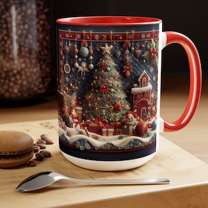 May include: A white ceramic mug with a red rim and handle. The mug features a festive Christmas scene with a decorated tree, presents, and a gingerbread house. The scene is surrounded by a blue and white patterned border.