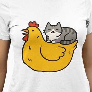 Cat and Chicken T-Shirt, Cute Cartoon Hen with Sleeping Kitty Graphic, Farm Animal Humor Shirt, Cozy Cottagecore Gift for Pet Lovers Top