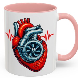 May include: White ceramic mug with a pink interior and handle. The mug features a graphic of a red heart with a turbocharger design and a red heartbeat line. A unique gift for car enthusiasts.