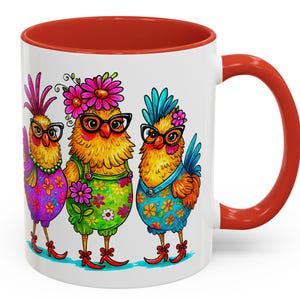 May include: White ceramic mug with a red interior and handle. The mug features a colorful illustration of three anthropomorphic chickens wearing glasses and floral outfits. The chickens are in purple, yellow, and blue. The mug is a fun and whimsical gift.
