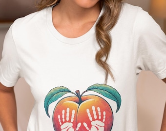 Unique Peach Art Unisex T-Shirt with Handprints, Vibrant Peach Novelty Tee Design, Artistic Fruit Lover Shirt, Peach Graphic Top Gift Idea