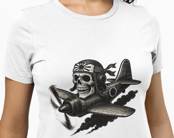 May include: White t-shirt featuring a black and white graphic of a skull wearing a pilot's helmet and flying a vintage airplane. The plane has a rising sun emblem and is emitting smoke.