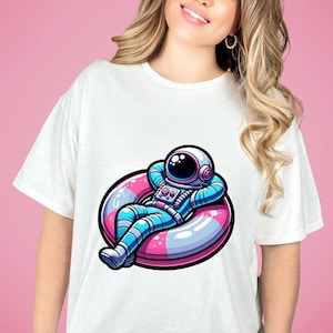 Space-Themed Unisex T-Shirt, Astronaut Lounging Shirt Design, Galaxy Inflatable Ring Tee Top, Unique Cosmic Fashion, Gift for Her/Him