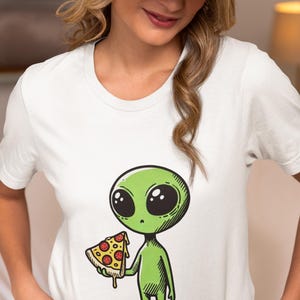 Green Alien with Pizza Slice Unisex T-Shirt, Pepperoni Lover Novelty Tee, Unique Extraterrestrial Foodie Shirt,Pizza & UFO Fan Top Gift Idea