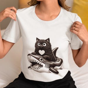 Cute Black Cat Riding Shark Inflatable T-Shirt, Funny Gothic Cat Shirt, Kawaii Cat Lover Gift, Shark Float Cat Tee, Unisex Cat Graphic Top