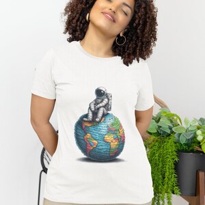 Astronaut Contemplation Unisex T-Shirt-Cosmic Explorer on Textured Earth,Space Traveler Apparel,Galaxy Adventurer Tee,Planetary Dreamer Top