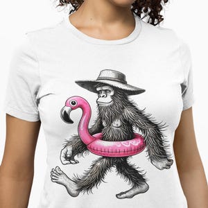Bigfoot with Flamingo Pool Float Graphic Tee, Retro Sasquatch Beach Shirt for Men & Women, Summer Cryptid T-Shirt for Pool or Vacation Vibes