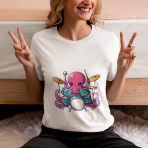 Pink Octopus Playing Drums Unisex T-Shirt, Fun Drummer Novelty Tee for Music Lovers, Unique Shirt Gift Idea, Cool Band Graphic Top