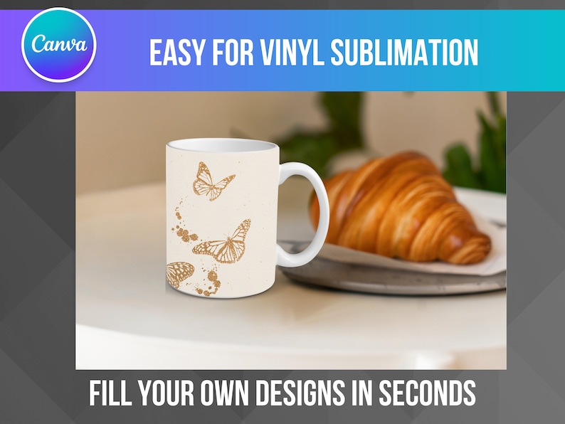 May include: White ceramic mug with a design of gold butterflies on a white background. The mug is sitting on a white surface with a croissant in the background.