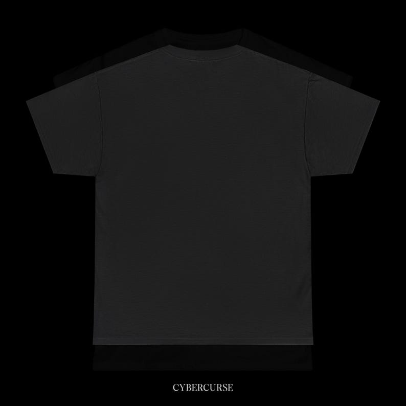 May include: Three black t-shirts are stacked on top of each other against a black background. The bottom shirt has the word "CYBERCURSE" printed in white at the bottom.