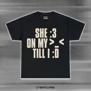 sillly she :3 on my &gt;_&lt; y2k vamp text shirt