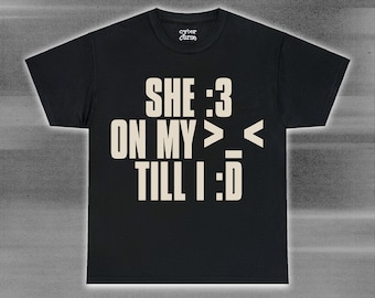 sillly she :3 on my >_< y2k vamp text shirt