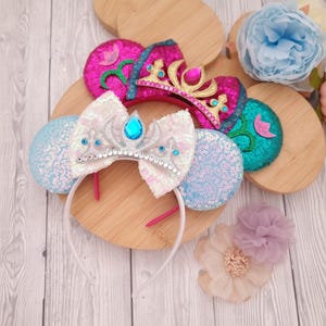 Disney character mouse ears: Princess Elsa Anna Frozen Snowflake Crown bow headband — Disney holiday fun!