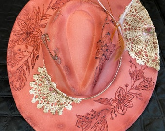 Pink wide brim fedora with custom painting and floral burning.