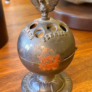 Antigua hucha de hierro fundido con forma de globo terráqueo y águila, de Enterprise MFG, circa 1875