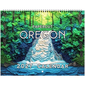 May include: A 2027 wall calendar featuring a papercut art design of a waterfall surrounded by a lush forest. The artwork uses layered shades of green, blue, and white paper to create depth. The text reads PAPERCUT OREGON 2027 CALENDAR.