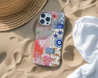 Puede incluir: Una funda blanca para iPhone con un diseño de collage colorido que incluye un corazón rosa, un ojo azul, una estrella de mar blanca y un tigre. La funda está sobre una superficie arenosa.