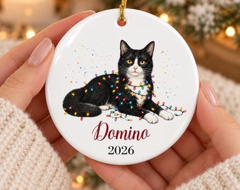 Tuxedo Cat Christmas Ornament, Black and White Cat Wrapped in Christmas Lights, Personalized Name and Year, Double Sided Ceramic Keepsake