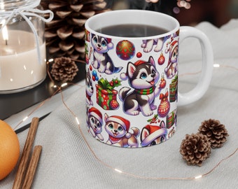May include: White ceramic mug with a Christmas-themed design featuring cartoon husky dogs wearing Santa hats and holding presents. The mug is filled with a dark liquid and has a steam rising from it.